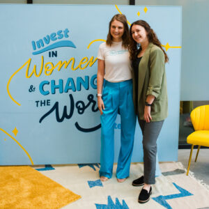 WVS attendees standing in front of mural