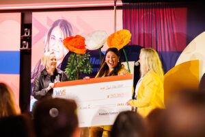 Women's Venture Summit - Silvia Mah and Barbara Clarke presenting the WFP2024 winner Hailey Marie Keith of Mito with check